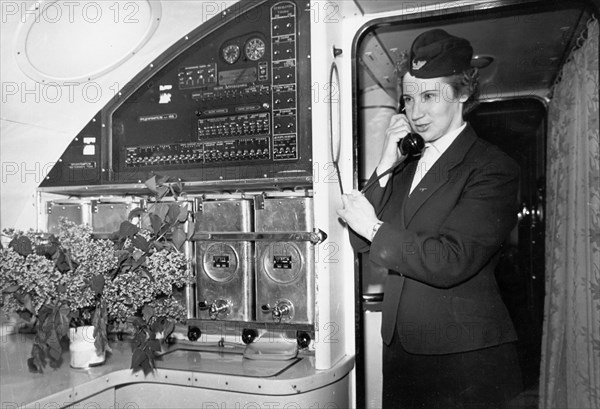 A stewardess taking dinner orders aboard a tu-114 airliner (at the time, the world's largest), may 1959.