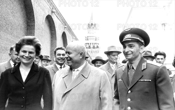 Nikita khrushchev with soviet cosmonauts tereshkova and bykovsky on the grounds of the moscow kremlin after the celebration rally in their honor on june 22, 1963.
