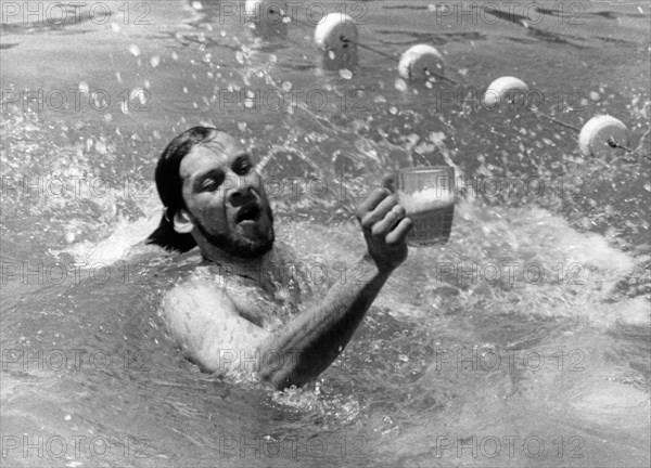 A member of the beer lovers' party preparing for the olympics, sochi, ruslla, july 1994.