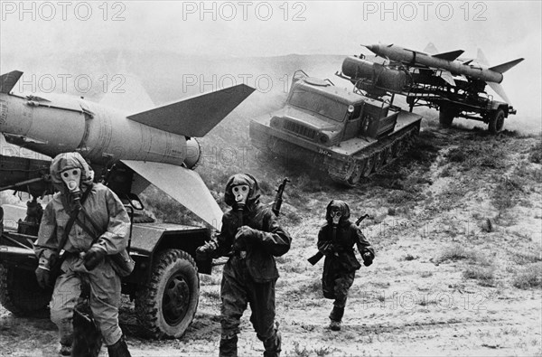 Soldiers of an anti-aircraft unit of the soviet army undergoing chemical warfare training, 1974, sam-2 (guideline) surface-to-air missiles.