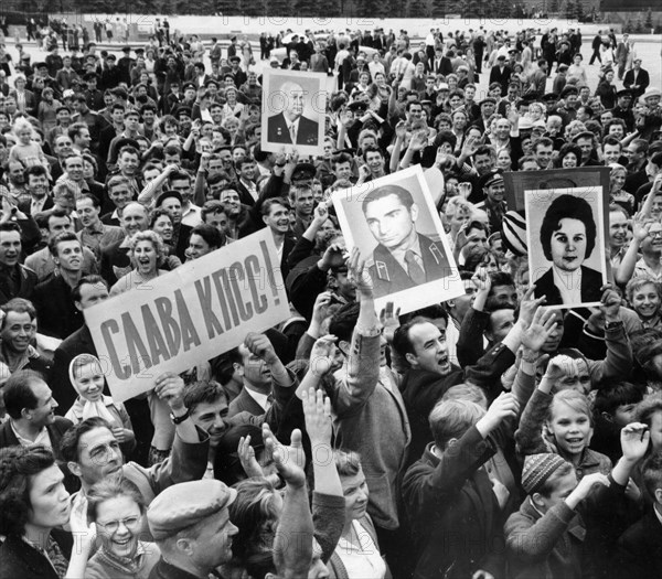 Moscow residents cheering the news of a successful launch of vostok 5 space craft, piloted by soviet woman cosmonaut valentina tereshkova, the picture was taken 5 minutes after the official tass announcement, april 1963.