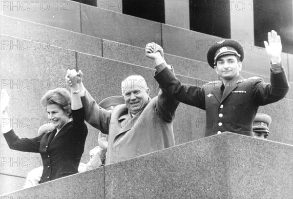 Nikita khrushchev with soviet cosmonauts tereshkova and bykovsky on the lenin mausoleum during the celebration rally in their honor on june 22, 1963, moscow, ussr.