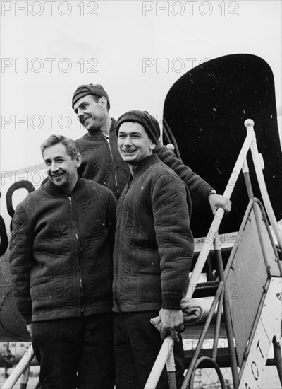 Voskhod 1, soviet cosmonauts (l to r) constantine feoktistov, vladimir komarov, and boris yegorov after landing at vnukovo airport in moscow, october 1964.