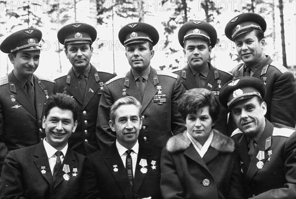 A memorial photo taken upon the return of the 3 cosmonauts of the voskhod mission to 'star town' near moscow: (1st row l to r) boris yegorov, konstantin fecktistov, valentina tereshkova, vladimir komarov; (2nd row l to r) valery bykovsky, german titov, yuri gagarin, andriyan nikolayev, pavel popovich, 1964.