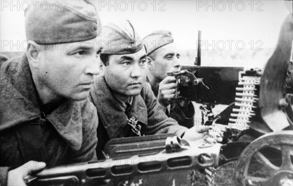 Russian kolesnikov, kirghiz azhekinbayev and ukrainian chepenev, a machine-gun team was fighting against fascists near stalingrad in 1942.