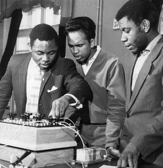 The peoples' friendship university in moscow, founded in 1960 and renamed the patrice lumumba university in 1961, second year engineering students (l to r) erick omeili (nigeria), danasena suria arachige (ceylon), and abdulla hadji (zanzibar) during studies in the electric laboratory, early 1960s.