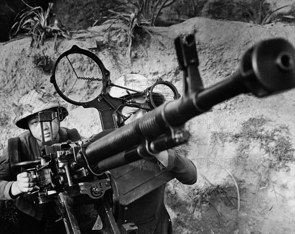 Two young women rice farmers from the village of hoa lok in thanh hoa province of north vietnam defend their village from american air-raids, september 1967, mai thi la (left) and nguen thi thy have been awarded the feat order of the third stage for their bravery.