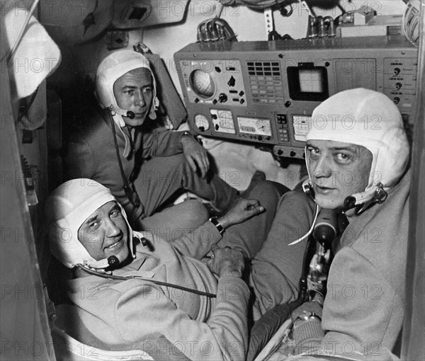 The crew of the soyuz 11 mission (l to r) test engineer viktor patsayev, commander georgi dobrovolsky, and flight engineer vladislav volkov in the cabin of the spacecraft, june 1971.