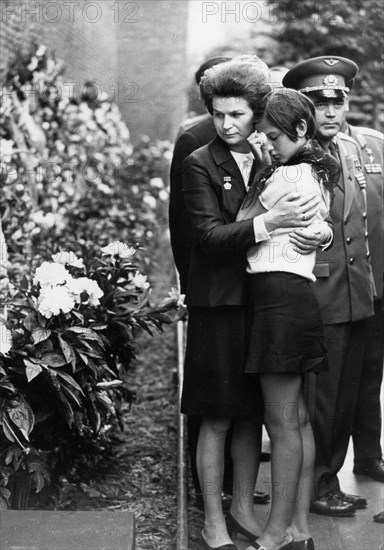 Funeral for the three cosmonauts of soyuz-11: g,t, dobrovolsky, v,n, volkov, and v,i, patsayev, valentina tereshkova and andrian nikolayev with maria dobrovolskaya, the daughter of one of the cosmonauts, july 2, 1971.