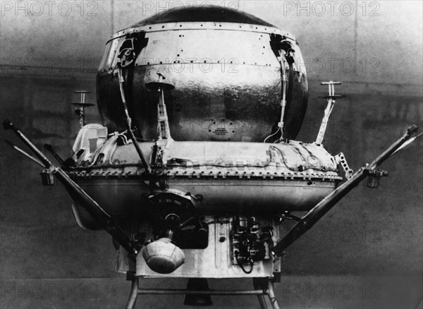 The landing capsule of the soviet space probe, mars 3 in the assembly shop, the parachute container is seen on top along with the opening system installed, on the sides are bars for fastening the braking cone.