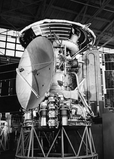 The soviet space probe mars 3 in the assembly shop, the braking cone and parachute container can be seen on top and the solar panels are extended, 1971.