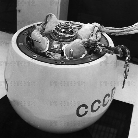 The landing capsule of the soviet space probe, venera 7 on display at the cosmos pavilion at the exhibition of national economic achievements (vdnkh) in moscow, 1970, note the bas-relief emblem with the likeness of lenin in the center.