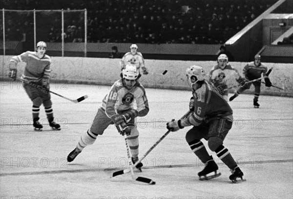 M, gartner (canada) and v, avgeykin (spartak) during a match between the junior teams 'berry coap' from ontario and moscow's 'spartak' at skolniki sport palace on march 6, 1975, the game was tied, 5 to 5.