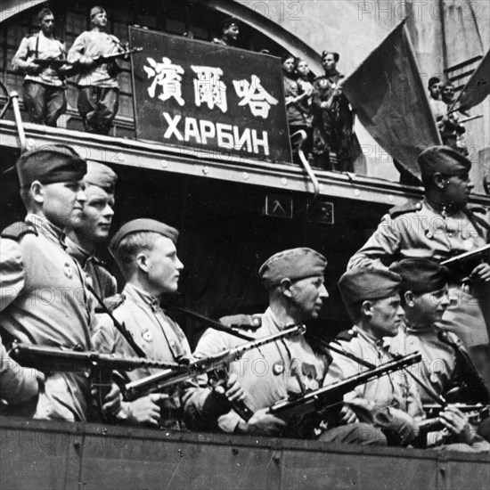 Operation august storm (battle of manchuria), soviet troops hoisted the flag of victory over the harbin railway station, manchuria, august 19, 1945.