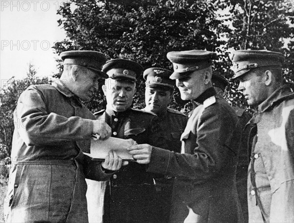 Nikita khrushchev and marshal konev at a command post of the 1st ukrainian front headquarters before the beginning of battle actions to liberate poland, june 1944.