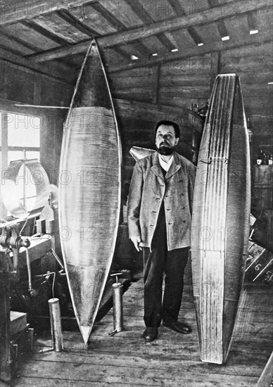 Konstantin tsiolkovsky, pioneer scientist in the field of rockets and space travel (cosmonautics), standing with his all-metal airship models in his workshop in kaluga in 1913, ussr.