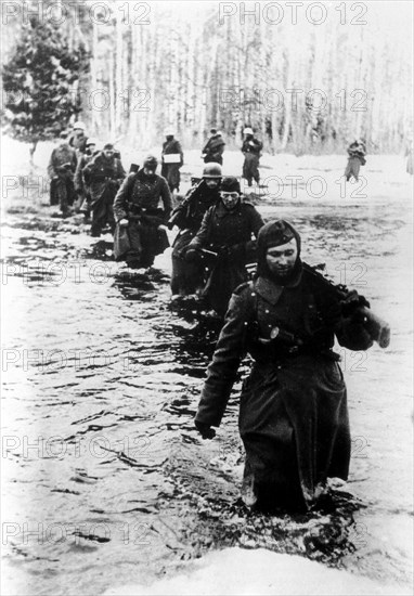Nazi german troops retreat from their bridgehead near the city of demyansk, in march, 1943.