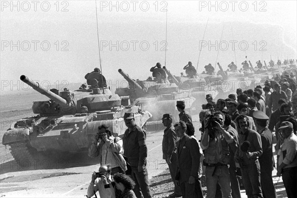 A column of the soviet tankers leaving afghanistan for their motherland , the withdrawal of the soviet forces was concluded on february 15, 1989.