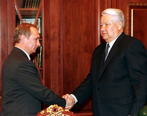 Moscow, russia, russian president boris yeltsin (r) shaking hands with premier vladimir putin, october 1999, boris yeltisn declared on friday, dec,31, that he resigned from the post of the president and turns over his power to prime minister vladimir putin.