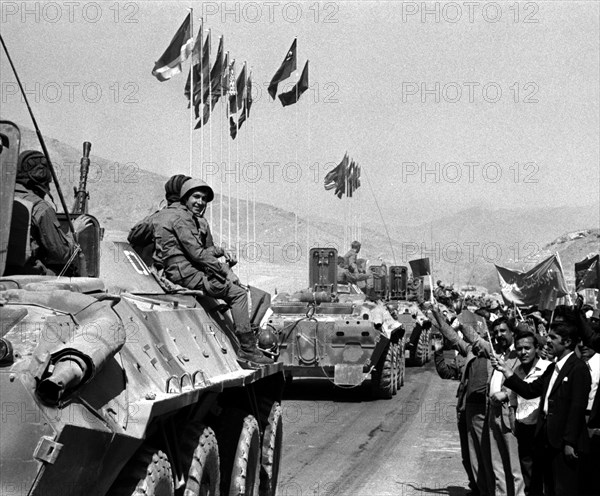 Afghanistan, afghani men bid farewell to soviet soldiers who are on their way home from afghanistan, 1989.