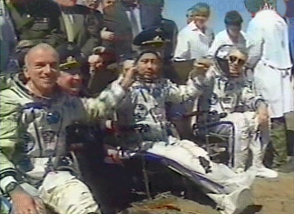 May 6, 2001, american multimillionaire dennis tito, 60, (left) following an eight-day space flight which cost him 20 million dollars, safely returned on sunday to earth together with his russian crewmates -- talgat musabayev (centre) and yuri baturin (right), their descent capsule touched down in kazakhstan at 09:41 moscow time near the city of arkalyk,the crew members feel themselves so well that they asked a permission to get out of the descent capsule on their own.