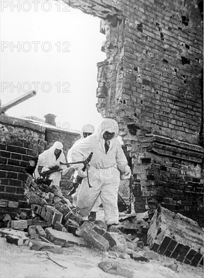 Battle of stalingrad, january 1943, red army soldiers in snow camoflage during street fighting .