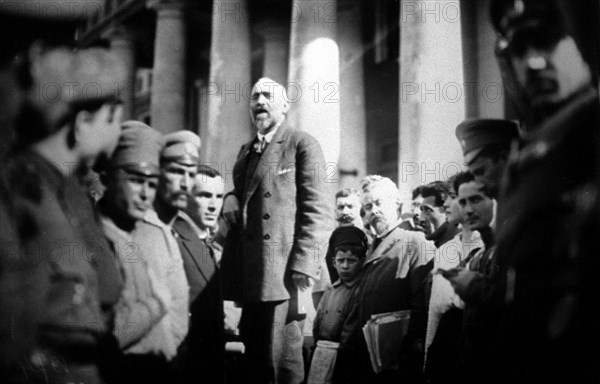 Nikolai semyonovich chheidze, a leading menshevik, reads a statement at the taurian palace, in st,petersburg, russia, 1917, february revolution.