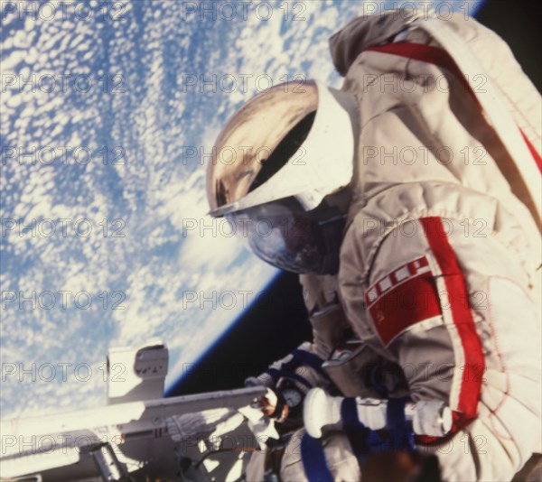 Cosmonaut leonid kizim walking in space during the salut 7-soyuz t-11-soyuz t-12 mission, photo taken by cosmonaut vladimir solovyov, 1984.