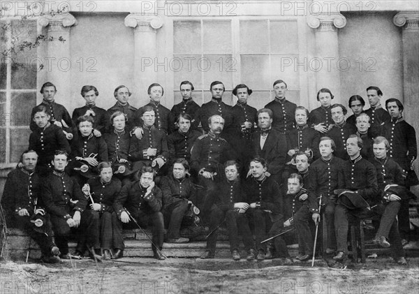Russian composer pyotr tchaikovsky in his 1859 graduation class of the imperial school of jurisprudence, st, petersburg, russia, tchaikovsky (19) is sitting sixth from right in front row, holding hands with the boy sitting beside him.