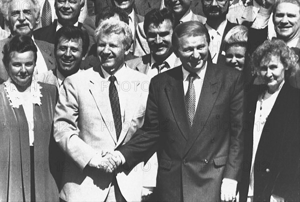 Ukrainian president leonid kuchma (right) and chairman of the ukrainian supreme soviet alexander moroz shaking hands and congratulating each other on june 28, 1996 on the ukrainian parliament's has approval of the new ukrainian constitution, kiev, ukraine.
