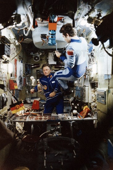 Cosmonauts vladimir kovalyonok (soyuz 29, right) and sigmund jahn from the gdr (soyuz 31) aboard the salyut 6 space station, august 1978.