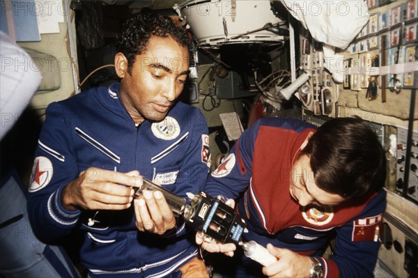 Cuban researcher-cosmonaut lieutenant-colonel arnaldo tamayo mendez and soviet cosmonaut colonel yuri viktorovich romanenko aboard the salyut 6 space station, soyuz 38, 1980.