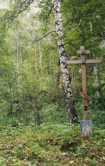 A cross marking alleged original burial site of tsar nicholas ll and the romanov royal family, yekaterinburg, russia, 1992.