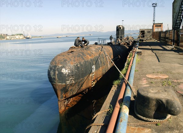 Maritime territory, russia, august 4, 2004, another ship waiting for its turn at the facility for nuclear-powered submarines utilization, the 'zvezda' plant in the city of bolshoy kamen is occupied with utilization of thirty decommissioned submarines.