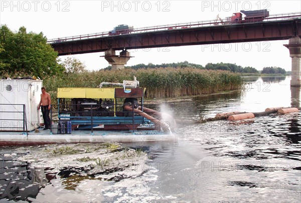 Russia, voronezh region, piles of the bridge across the voronezh river located at the 500th kilometre of the 'don'' federal highway are strengthened by sand, october 14, 2004.