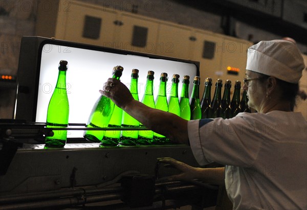 Moscow, russia, november 29, 2010, sovetskoye shampanskoye white wine being checked for quality at kornet, a moscow-based champagne winery.