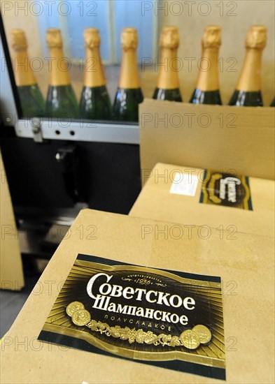 Moscow, russia, november 29, 2010, bottles of sovetskoye shampanskoye being packed in boxes at kornet, a moscow-based champagne winery.