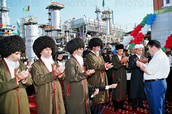Turkmenistan, september 14,2005, muslim clergy, elders and president of turkmenistan saparmurat niyazov (r) pray during a solemn ceremony of launching the gas compressor station at korpeje oil and gas field located in gogerendag-ekerem region.