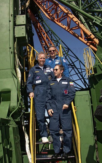 Baikonur, kazakhstan, september 27, 2005, the crew of the 12th expedition to the international space station, cosmonaut valery tokarev of russia (front) u,s, space tourist gregory olsen (middle) and astronaut william mcarthur of the u,s, look over the launching complex at baikonur cosmodrome in kazakhstan, the crew are due to blast off from here in october.
