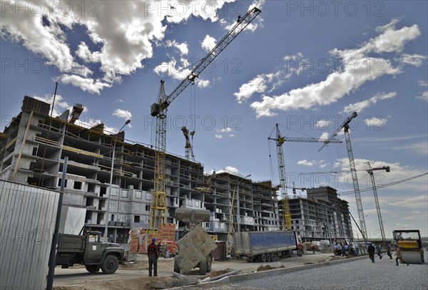 Yekaterinburg, russia, october 7, 2011, apartment block under construction at akademichesky housing development, in the city of yekaterinburg, according to renova stroi group, the company managing the project, akademichesky is largest construction project of its kind in russia and europe, the housing development covers an area of 1300 hectares and will house 325 thousand residents upon its completion.