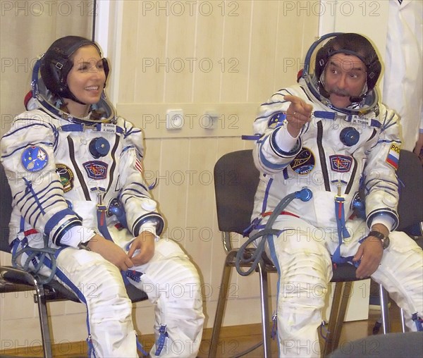 Baikonur, kazakhstan, september 18, 2006, first female space tourist anousheh ansari, left, and russian cosmonaut, flight engineer, mikhail tyurin (roskosmos) of the 14th iss crew seen before the launch of soyuz fg rocket booster.