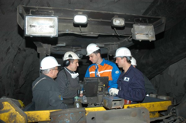 Norilsk, russia, march 21, 2007, norilsk nickel ceo mikhail prokhorov, second from right, and companyi´s future ceo denis morozov, right, talk to miners while touring the oktyabrsky mine of the norilsk nickel.