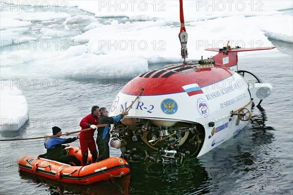 Arctic ocean, august 8, 2007, mir-2 submersible is being descent from the akademik fedorov research ship during the russian polar expedition 'arctic-2007'.