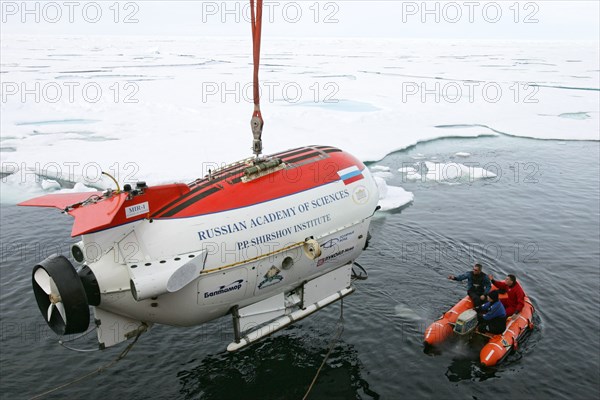 Arctic ocean, august 8, 2007, mir-1 submersible is being descent from the akademik fedorov research ship during the russian polar expedition 'arctic-2007'.
