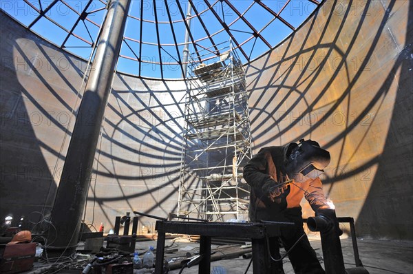 Amur region, russia, april 27, 2009, welder at work at skovorodino pump station, at the construction site of a branch pipeline which will run into china from the eastern siberia – pacific ocean (espo) oil pipeline.