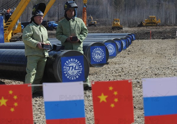 Amur region, russia, april 27, 2009, russian and chinese flags at the construction site of a branch pipeline which will run into china from the eastern siberia – pacific ocean (espo) oil pipeline.