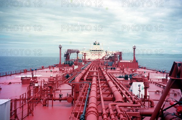 Yuzhno-sakhalinsk, russia, june 25 1999: a view of several kilometres of pipes which are laid to receive and dispatch oil on the deck of a 158,000-tonne tanker