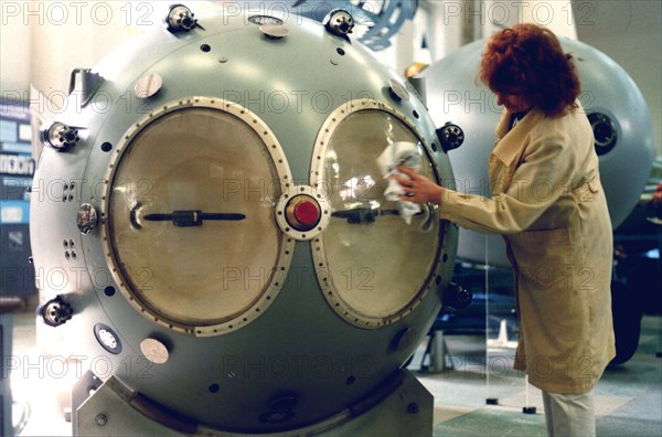 An attendant of the russian nuclear weapon museum in the town of sarov cleaning a mock-up of the first soviet atomic bomb (rds-1 type), nizhny novgorod region, russia, august 25, 1999, the federal nuclear centre is preparing to mark the half-century anniversary of the soviet a-bomb`s first detonation which occurred on august 29,1949.