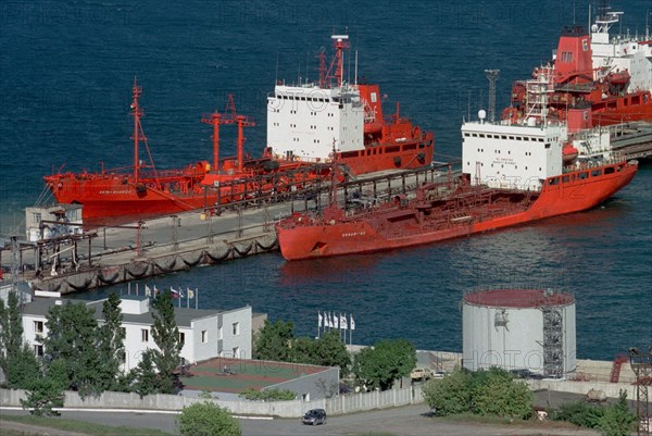 Maritime territory, russia, october 3, 2001, picture shows tankers being filled with fuel to be delivered to chukotka peninsula , the necessary 150 thousand tons of oil and lubricants will be supplied to this russian extreme northern territory to the middle of october.