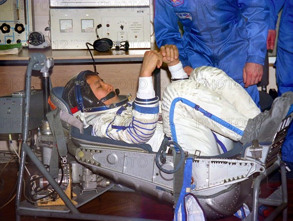 Kazakhstan, april 11, 2003, the flight engineer of the soyuztma-2 spacecraft edvard lu (c) is trying on his space suit during preparation for the flight at cosmodrome baikonur, the spaceship soyuztma-2 will be launched from the cosmodrome on april.